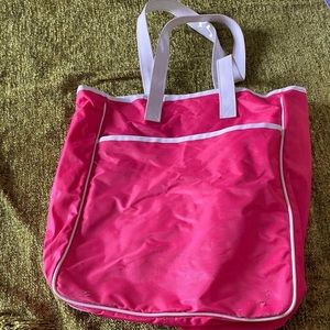 Hot pink tote bag with spacious pocket on front